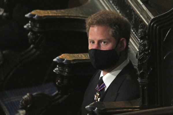 Prince Harry sits alone at St. George’s Chapel during the funeral for Prince Philip, at Windsor Castle, Windsor, England, Saturday April 17, 2021. Prince Philip died April 9 at the age of 99 after 73 years of marriage to Britain's Queen Elizabeth II. (Yui Mok/Pool via AP)