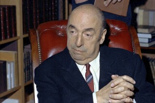 FILE - Nobel Prize-winning poet Pablo Neruda sits in Paris in October 1971. An appeals court in Chile’s capital ruled Tuesday, Feb. 20, 2024, that the case of Neruda's death be reopened, saying the investigation has not been exhausted and new steps could help clarify the cause of his death. Last December, a judge rejected a request by Neruda's nephew to reopen the case to look for other causes of death than cancer, which is what is listed on the poet’s death certificate. (AP Photo/Michel Lipchitz, File)