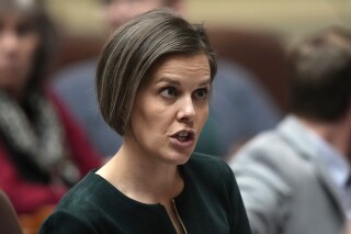 Rep. Laurel D. Libby, R - Auburn, speaks with a colleague, Feb. 14, 2023, at the State House in Augusta, Maine. (AP Photo/Robert F. Bukaty, file)