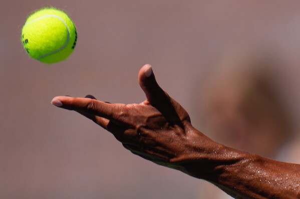 A tennis ball is tossed in the air, Saturday, Sept. 2, 2023, in New York. (AP Photo/Manu Fernandez, File)