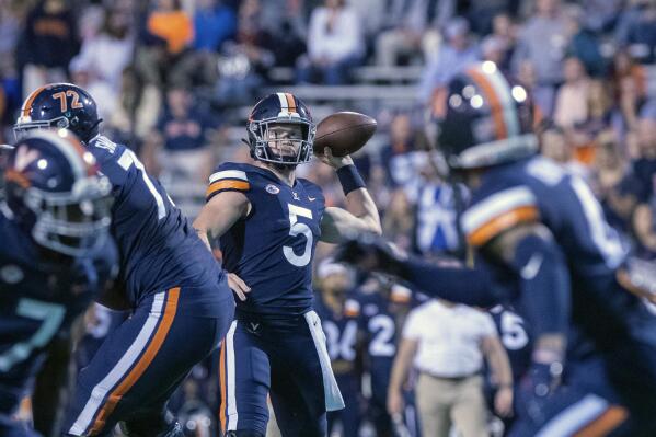 Virginia quarterback Brennan Armstrong (5) throws the ball during an NCAA college football game against Wake Forest Friday, Sept. 24, 2021, in Charlottesville, Va. (Erin Edgerton/The Daily Progress via AP)