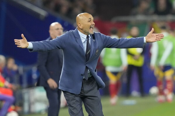 Italy's head coach Luciano Spalletti gives instructions from the side line during a Group B match between Spain and Italy at the Euro 2024 soccer tournament in Gelsenkirchen, Germany, Thursday, June 20, 2024. (AP Photo/Frank Augstein)
