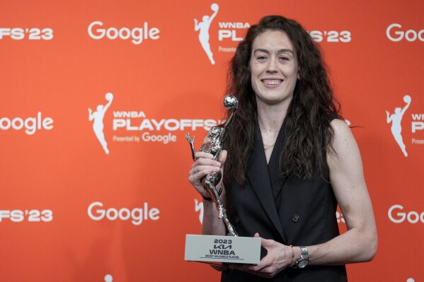 New York Liberty forward Breanna Stewart holds her WNBA MVP trophy during a news conference, Tuesday, Sept. 26, 2023, at Barclays Center in New York. (AP Photo/Mary Altaffer)