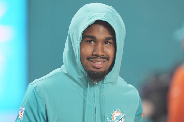 Miami Dolphins wide receiver Jaylen Waddle walks the field before an NFL football game against the Buffalo Bills, Sunday, Jan. 7, 2024, in Miami Gardens, Fla. (AP Photo/Wilfredo Lee)