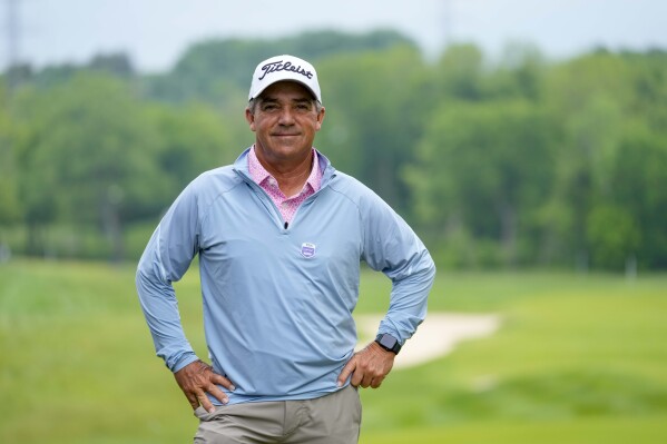 Tracy Phillips poses for a picture at the PGA Championship golf tournament at the Valhalla Golf Club, Tuesday, May 14, 2024, in Louisville, Ky. The 61-year-old club pro qualified for the tournament this year. (Ǻ Photo/Matt York)