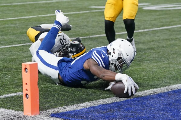 Indianapolis Colts running back Tyler Goodson is tackled short of the end zone by Pittsburgh Steelers linebacker Elandon Roberts (50) during the first half of an NFL football game in Indianapolis on Saturday, Dec. 16, 2023. (AP Photo/Darron Cummings)