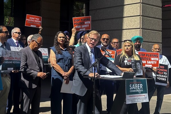  FILE - Greg Totten, a representative of Californians for Safer Communities, speaks at a press conference about a ballot initiative to bring back penalties for shoplifting and drug offenses on Wednesday, June 12, 2024, in Sacramento,  Calif. The tough-on-crime initiative could play a key role in a handful of contested U.S. House races that would help determine control of Congress. (AP Photo/Tran Nguyen, File)