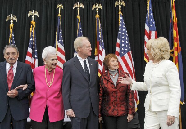 FILE - In this Jan. 3, 2011 file photo, Arizona Gov. Jan Brewer, right, greets former Arizona governors, from left to right, Raul Castro, Rose Mofford, J. Fife Symington III, and Jane Hull after inaugural ceremonies at the Arizona Capitol in Phoenix. Hull, the first woman elected governor of Arizona and the state's first female House speaker, has died. She was 84. Gov. Doug Ducey announced her death on Friday, April 17, 2020 saying, “Governor Hull dedicated 25 years to principled public service.” (AP Photo/Ross D. Franklin, File)