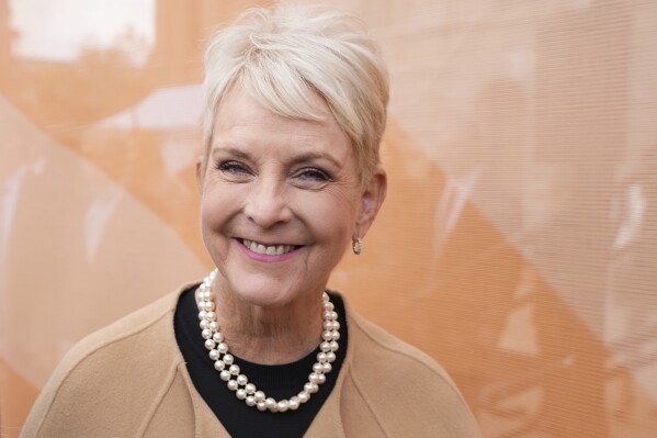 FILE - U.S. Ambassador Cindy McCain, wife of former Arizona Republican Sen. John McCain, smiles as she arrives for the public ceremonial inauguration of Arizona Democratic Gov. Katie Hobbs at the state Capitol in Phoenix, Jan. 5, 2023. A global hunger crisis has left more than 700 million people not knowing when or if they will eat again, and demand for food is rising relentlessly while humanitarian funding is drying up, the head of the United Nations food agency said Thursday, Sept. 14. (AP Photo/Ross D. Franklin, File)