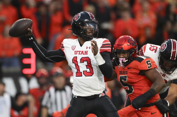 Utah quarterback Nate Johnson (13) drops back to pass against Oregon State during the first half of an NCAA college football game Friday, Sept. 29, 2023, in Corvallis, Ore. (AP Photo/Amanda Loman)