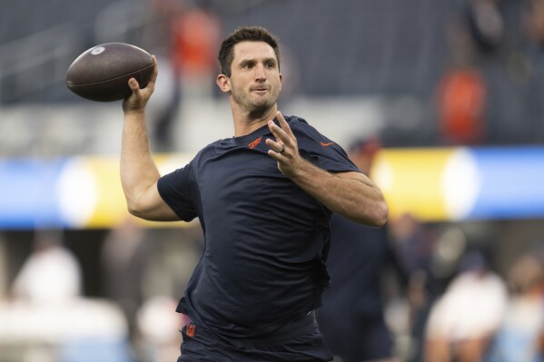 FILE - Then-Chicago Bears quarterback Nathan Peterman (14) warms up before an NFL football game against the Los Angeles Chargers, Sunday, Oct. 29, 2023, in Inglewood, Calif. (AP Photo/Kyusung Gong, File)