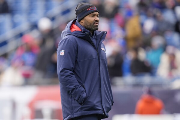 New England Patriots head coach Jerod Mayo walks on the field prior to an NFL football game against the Buffalo Bills, Sunday, Jan. 5, 2025, in Foxborough, Mass. (AP Photo/Robert F. Bukaty)