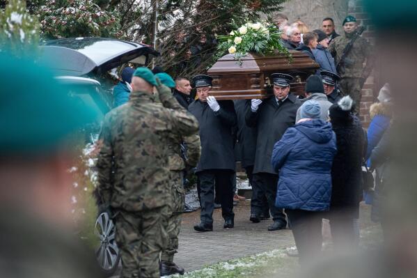 Pallbearers carry the coffin of Boguslaw Wos, one of two Polish men killed in a missile explosion, in Przewodow, Poland, Saturday, Nov. 19, 2022. A funeral for Wos was held on Saturday. Western officials said the deaths appeared to have been caused by a Ukrainian air defense missile that went astray as the country was defending itself against a barrage of Russian missiles directed at Ukraine’s power infrastructure. (AP Photo)
