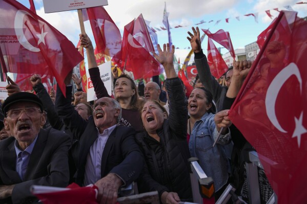 People chant slogans during a protest against the arrest and removal from office of a mayor from Turkey's main opposition party for alleged links to a banned Kurdish militant group, in Istanbul, Turkey, Thursday, Oct. 31, 2024. (AP Photo/Khalil Hamra)
