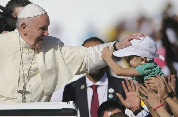 
              Pope Francis blesses a boy during a Mass at the Sheikh Zayed Sports City in Abu Dhabi, United Arab Emirates, Tuesday, Feb. 5, 2019. Francis travelled to Abu Dhabi to participate in a conference on inter religious dialogue sponsored the Emirates-based Muslim Council of Elders, an initiative that seeks to counter religious fanaticism by promoting a moderate brand of Islam. (AP Photo/Kamran Jebreili)
            