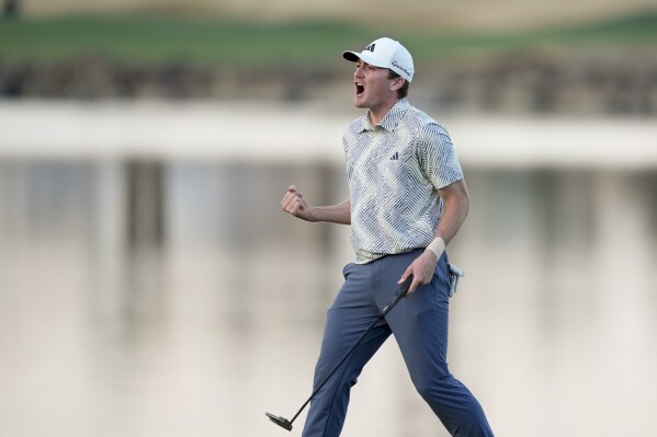 FILE - Nick Dunlap reacts after making his putt on the 18th hole of the Pete Dye Stadium Course during the final round to win the American Express golf tournament, Jan. 21, 2024, in La Quinta, Calif. Dunlap had his spot secured at Pinehurst No. 2 for the U.S. Open last summer when he won the U.S. Amateur. But he’s no longer an amateur, left little choice but to turn pro when he won on the PGA Tour in January. It hasn’t been the smoothest ride since that point. (AP Photo/Ryan Sun, file)