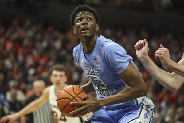 North Carolina's Jalen Washington looks for a shot during an NCAA college basketball game against Virginia, Saturday, Feb. 24, 2024 in Charlottesville, Va. (Cal Cary/The Daily Progress via AP)