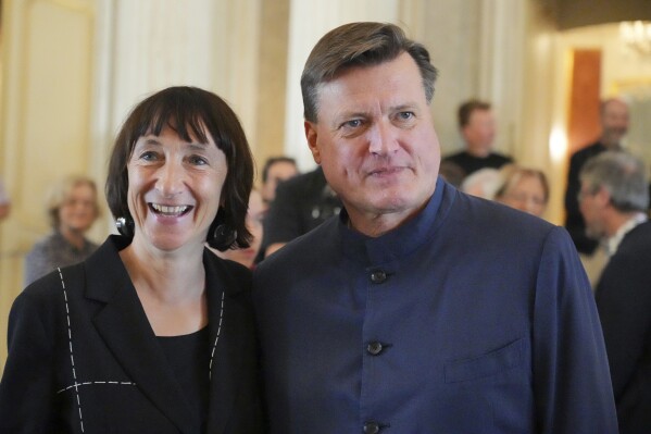 Christian Thielemann, future General Music Director of the Staatsoper Unter den Linden, right, and Elisabeth Sobotka, future Artistic Director of the opera, stand next to each other before the start of the press conference to introduce them, in Berlin, Wednesday, Sept. 27, 2023. Berlin's city government says Christian Thielemann has been chosen as the new general music director of the city's Staatsoper, months after Daniel Barenboim ended his three-decade reign. The state culture minister announced Wednesday that the 64-year-old German conductor will take the job at the Staatsoper, or State Opera, next year. (Soeren Stache/dpa via AP)