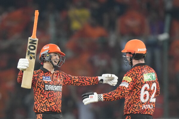 Sunrisers Hyderabad's Abhishek Sharma, left, celebrates his fifty runs with Travis Head during the Indian Premier League cricket match between Sunrisers Hyderabad and Lucknow Super Giants in Hyderabad, India, Wednesday, May 8, 2024. (AP Photo/Mahesh Kumar A.)