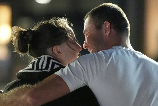 Ksenia Karelina, a dual US-Russian national, is embraced by her fiancé, professional boxer Chris van Heerden, at the Joint Base Andrews, Md., April 10, 2025, after she was released by Moscow in a prisoner swap. (AP Photo/Alex Brandon)