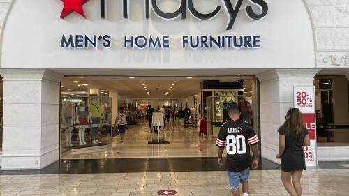 FILE - Shoppers walk into a Macy's department store Monday, Feb. 22, 2021, at Miami International Mall in Doral, Fla. Macy's reports their earnings on Thursday, June 1, 2023. (AP Photo/Wilfredo Lee)