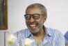 William Strickland laughs in theis 2016 photo in Austria. William Strickland, a longtime civil rights activist and supporter of the Black Power movement who worked with Malcom X and other prominent leaders in the 1960s, has died. (Rene Wieland via AP)