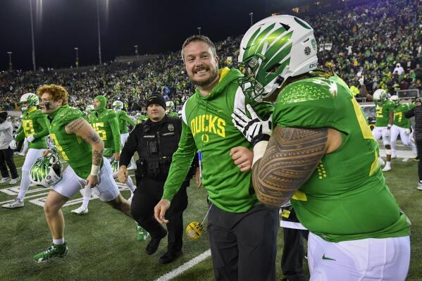 Oregon head coach Dan Lanning celebrates the Ducks' 20-17 win over Utah in an NCAA college football game Saturday, Nov. 19, 2022, in Eugene, Ore. (AP Photo/Andy Nelson)