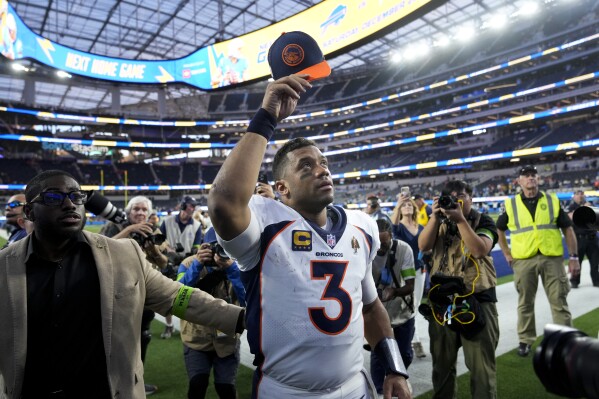 Denver Broncos quarterback Russell Wilson (3) acknowledges the fans as he leaves the field after the team's NFL football game against the Los Angeles Chargers Sunday, Dec. 10, 2023, in Inglewood, Calif. The Broncos won 24-7. (AP Photo/Marcio Jose Sanchez)