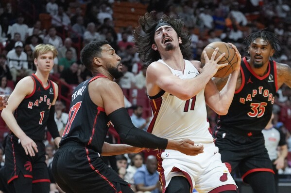 Miami Heat guard Jaime Jaquez Jr. (11) reacts after being fouled by Toronto Raptors forward Garrett Temple (17) during the first half of an NBA basketball game, Sunday, April 14, 2024, in Miami. (AP Photo/Rebecca Blackwell)