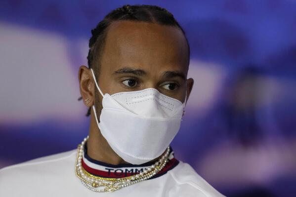 Mercedes driver Lewis Hamilton of Britain wears a face covering during a press conference at the Silverstone race track in Silverstone, Thursday, June 30, 2022. The British F1 Grand Prix is held on Sunday July 3,2022. (AP Photo/Matt Dunham)