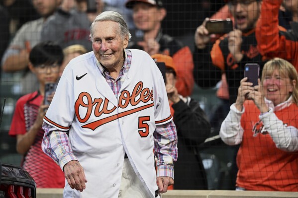 FILE - Former Baltimore Orioles third baseman Brooks Robinson is honored during a ceremony for the Hall of Fame before a baseball game between the Houston Astros and Baltimore Orioles, Sept. 24, 2022, in Baltimore. Robinson, whose deft glovework and folksy manner made him one of the most beloved and accomplished athletes in Baltimore history, has died, according to a joint announcement by the Orioles and his family Tuesday, Sept. 26, 2023. (AP Photo/Gail Burton, File)