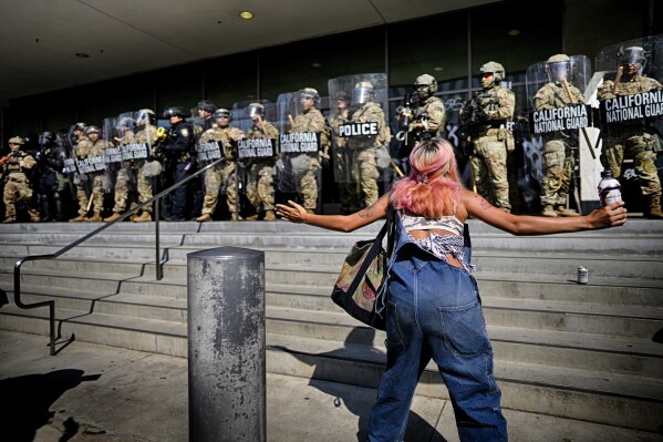 Protesters defied the California National Guard line to protect federal buildings in downtown Los Angeles on Monday, June 9, 2025 (AP Photo/Eric Thayer)