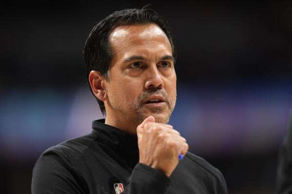 Miami Heat head coach Erik Spoelstra directs his team against the Denver Nuggets in the first half of an NBA basketball game Friday, Dec. 30, 2022, in Denver. (AP Photo/David Zalubowski)