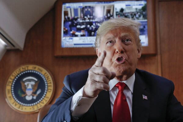 
              President Donald Trump, on board Air Force One, gestures while speaking to members of the travel press after watching a live television broadcast of the Senate confirmation vote of Supreme Court nominee Brett Kavanaugh, Saturday, Oct. 6, 2018. Trump was traveling from Washington enroute to Topeka, Kan., for a campaign rally. (AP Photo/Pablo Martinez Monsivais)
            