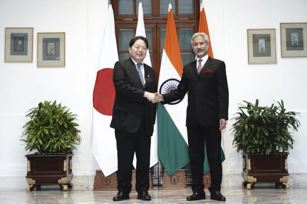 This photo from Indian Foreign Minister S.Jaishankar Twitter handle shows, him shaking hand with his Japanese counterpart Yoshimasa Hayashi, left, before their meeting in New Delhi, India, Thursday, July 28, 2023. India and Japan explored collaboration in critical and emerging technologies, including semiconductors and resilient supply chains, as part of a target of $35.91 billion Japanese investment in the country by 2027, officials said on Friday. (S.Jaishankar Twitter handle via AP)