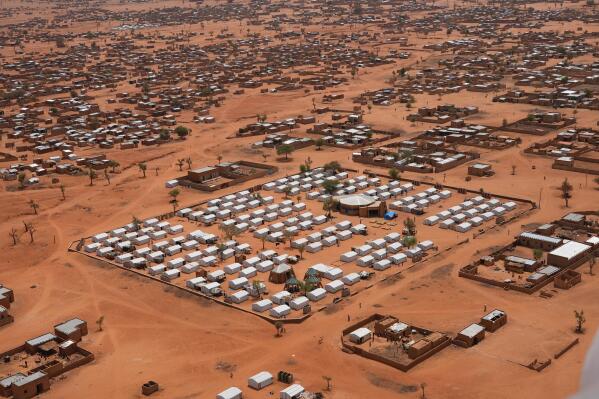 FILE- An aerial view shows a camp of internally displaced people in Djibo, Burkina Faso, May 26, 2022. Burkina Faso's government says more than 2 million people have become internally displaced, fueling a dire humanitarian crisis across the conflict-ridden country. The number of displaced people has mushroomed by more than 2,000% since 2019, when violence linked to al-Qaida and the Islamic State group began surging and spreading across the West African nation. (AP Photo/Sam Mednick, File)