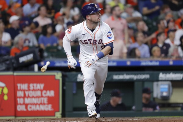 Houston Astros' Alex Bregman flips his bat as he watches his three run home run against the Cleveland Guardians during the third inning of a baseball game Tuesday, April 30, 2024, in Houston. (AP Photo/Michael Wyke)