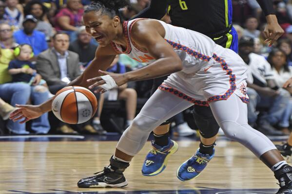 Dallas Wings forward Kayla Thornton commits a foul after colliding with Connecticut Sun forward Alyssa Thomas in Game 2 of a WNBA basketball first-round playoff series, Sunday, Aug. 21, 2022, in Uncasville, Conn. (Sean D. Elliot/The Day via AP)