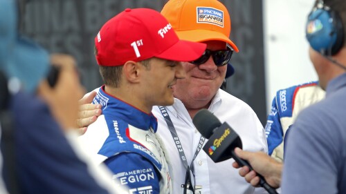Alex Paulo, left, is congratulated by team owner Chip Ganassi after winning the IndyCar auto race at Mid-Ohio Sports Car Course in Lexington, Ohio, Sunday, July 2, 2023. (AP Photo/Tom E. Puskar)