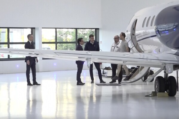 In this grab taken from video, Louis Arnaud disembarks a plane at Paris-Le-Bourget airport, in France, Thursday, June 13, 2024. French national Louis Arnaud arrived in France after being released by Iran where he was imprisoned for over 20 months for allegedly taking part in nationwide protests. Arnaud was greeted at Paris-Le-Bourget airport by his family and France’s foreign affairs minister. (Pool via AP)