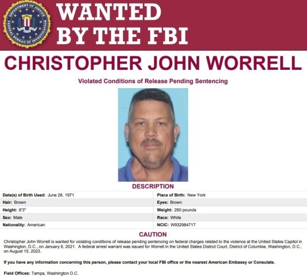 This image released by the FBI shows the wanted poster for Christopher Worrell. Authorities are searching for Worrell, a member of the Proud Boys extremist group, who disappeared days before his sentencing in a U.S. Capitol riot case, where prosecutors are seeking more than a decade in prison, according to a warrant made public Friday, Aug. 18, 2023. (FBI via AP)