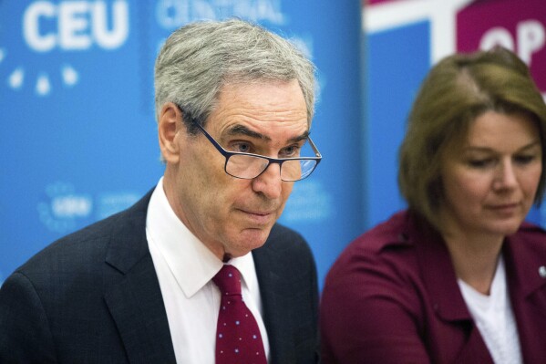 FILE - President and Rector of the Central European University, CEU, Michael Ignatieff, left, speaks during a press conference in Budapest, Hungary, Tuesday, May 30, 2017. Canadian historian and writer Michael Ignatieff has won Spain’s Princess of Asturias Award for Social Sciences for his “critical reflections on the major conflicts of our time,” prize organizers said Wednesday, May 15, 2024. (Zoltan Balogh/MTI via AP, File)