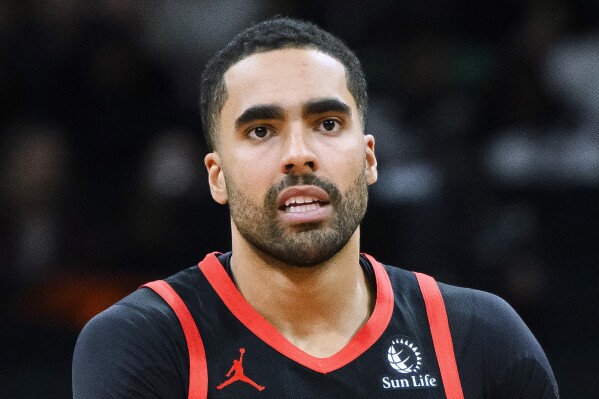 FILE - Toronto Raptors forward Jontay Porter is shown during the first half of the team's NBA basketball game against the Chicago Bulls, Jan. 18, 2024, in Toronto. Two more people, Timothy McCormack and Mahmud Mollah, have been charged in the sports betting scandal that prompted the NBA to ban former Toronto Raptors player Porter for life. (Christopher Katsarov/The Canadian Press via AP, File)