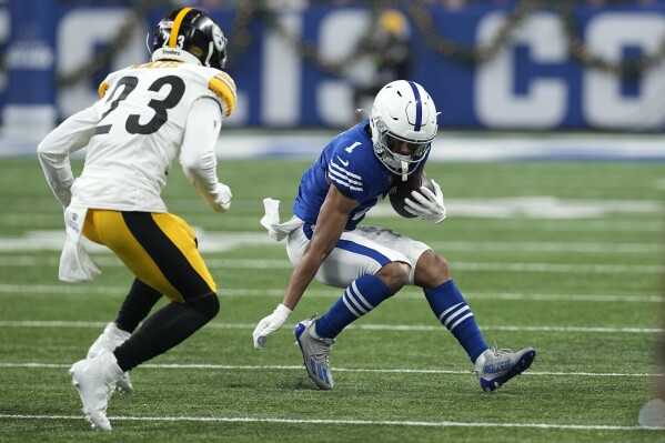 Indianapolis Colts wide receiver Josh Downs (1) runs after a catch with Pittsburgh Steelers safety Damontae Kazee (23) defending during the first half of an NFL football game in Indianapolis Saturday, Dec. 16, 2023. (AP Photo/Darron Cummings)