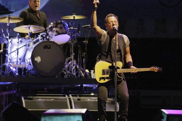 FILE - Max Weinberg plays the drums, left, while Bruce Springsteen and the E Street Band perform during The River Tour on Sept. 7, 2016, in Philadelphia. Weinberg is suing the owners of a Florida car restoration company, saying they stole $125,000 by falsely promising they could deliver a like-new 1957 Mercedes-Benz he could display at top-level shows and then using his money for personal expenses. (Elizabeth Robertson/Philadelphia Inquirer via AP)
