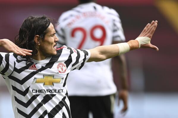 Manchester United's Edinson Cavani celebrates after scoring his side's third goal during the English Premier League soccer match between Aston Villa and Manchester United at Villa Park in Birmingham, England, Sunday, May 9, 2021. (Shaun Botterill/Pool via AP)