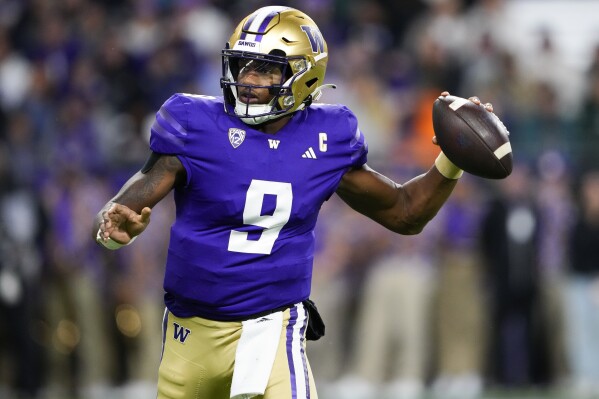 Washington quarterback Michael Penix Jr. looks for a receiver during the first half of the team's NCAA college football game against California on Saturday, Sept. 23, 2023, in Seattle. (AP Photo/Lindsey Wasson)