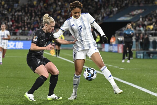 Philippines' Sarina Bolden, right, competes for the ball with New Zealand's C.J. Bott during the Women's World Cup Group A soccer match between New Zealand and the Philippines in Wellington, New Zealand, Tuesday, July 25, 2023. (AP Photo/Andrew Cornaga)