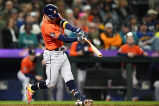 Houston Astros' Mauricio Dubon hits a three-run home run against the Seattle Mariners during the fourth inning of a baseball game Wednesday, Sept. 27, 2023, in Seattle. (AP Photo/Lindsey Wasson)