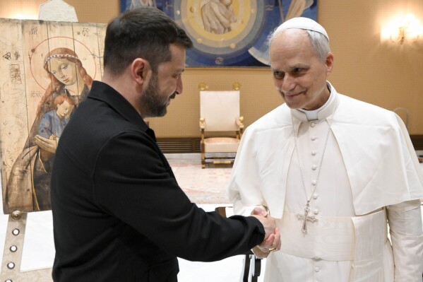 This picture made available by Vatican Media on Sunday, May 18, 2025, shows Pope Leo XIV meeting Ukraine's President Volodymyr Zelenskyy at the Vatican. (Vatican Media via AP)